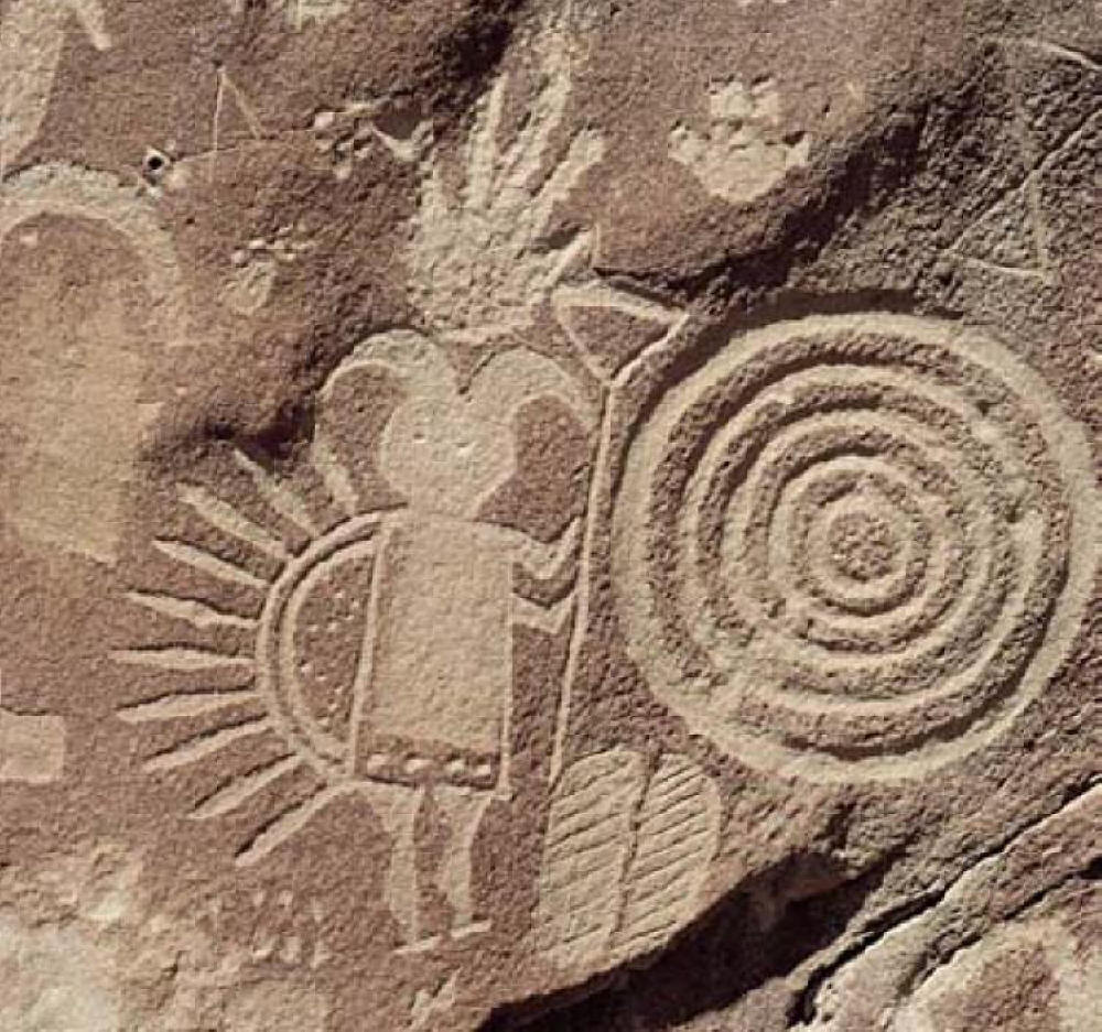 Spiral petroglyph with devil